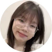 Asian woman with glasses, a kind smile and friendly attitude