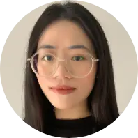 Asian woman with glasses, a kind smile and friendly attitude