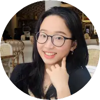 Asian woman with glasses, a kind smile and friendly attitude
